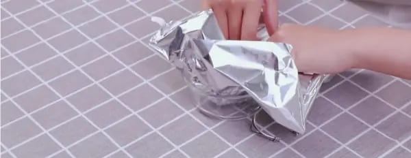 Line the container with aluminum foil